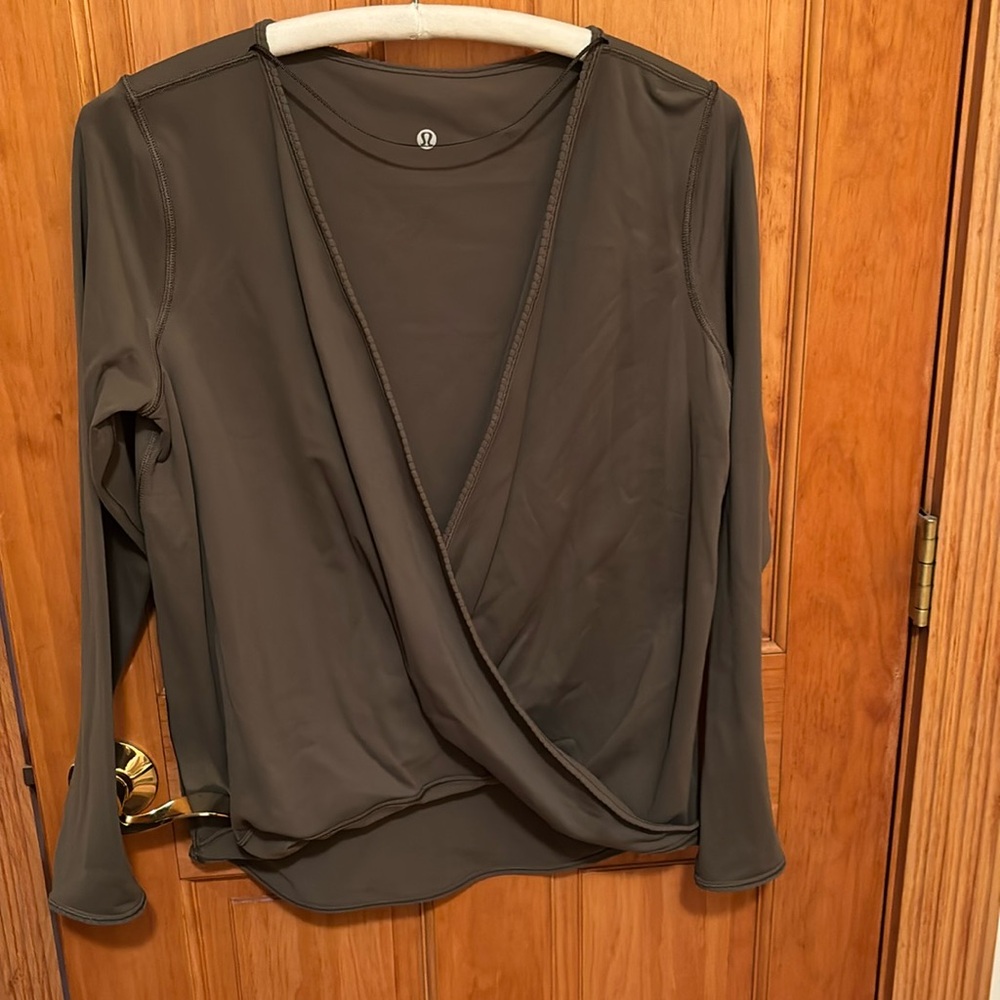 Army green wrap top by Lululemon in size 10.
